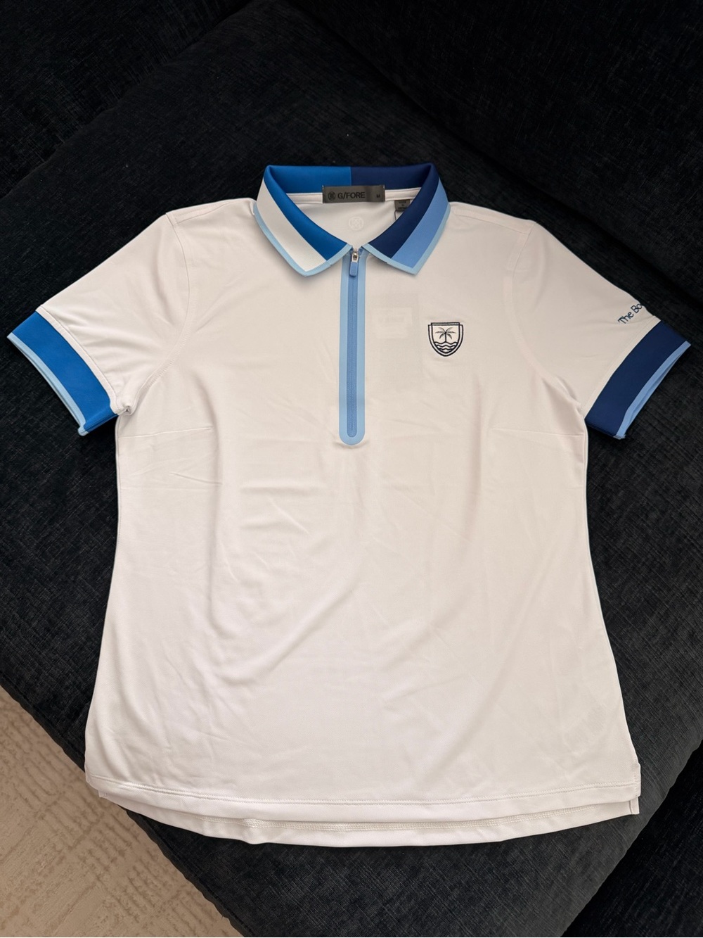 G/FORE Women’s White Polo with Blue Trim and Crest